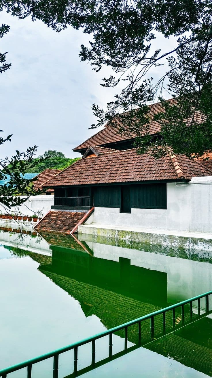 The traditional Kerala-style wooden architecture and gardens of the historic Krishnapuram Palace museum